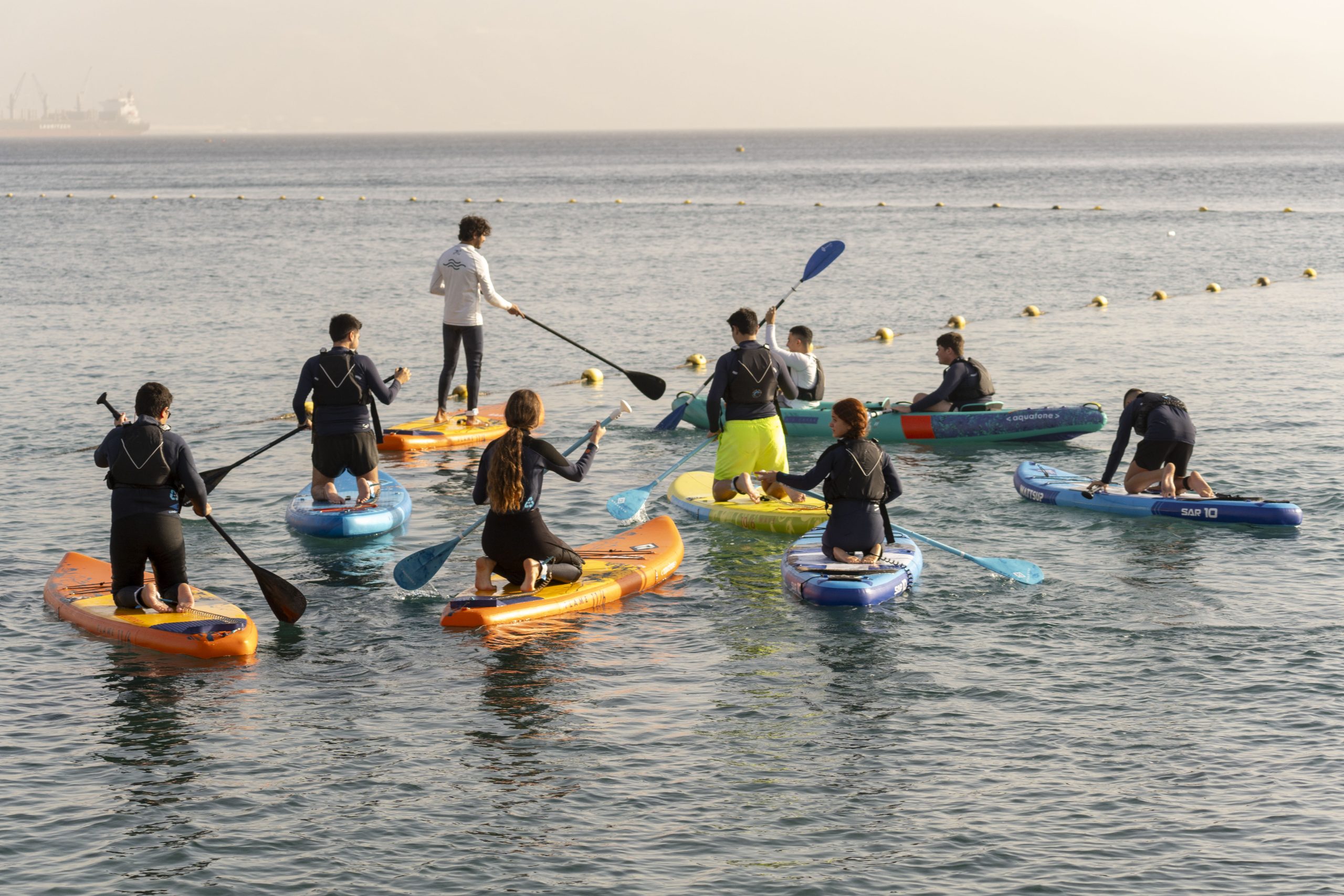 A group of Nir Oz evacuees at a 'House on the Sea' activity in Eilat.