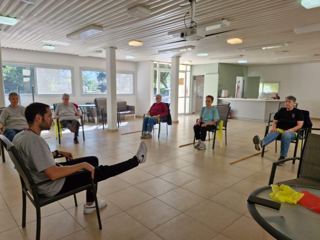 Group fitness class led by Omer.